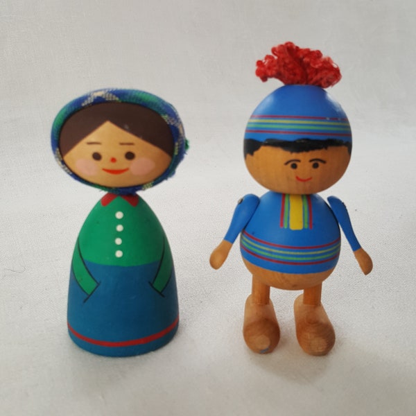 2 Vintage Swedish Folk Art Wooden Doll Miniatures. The boy is painted with Sami people coloured dress. The girl with an old fashion dress.