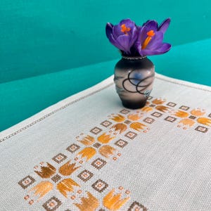 Hand Embroidered Small Tablecloth. Vintage Table Linen. Made in the 1960&#39;s. Hand Hemmed. Square Border of Tulips in the Middle.