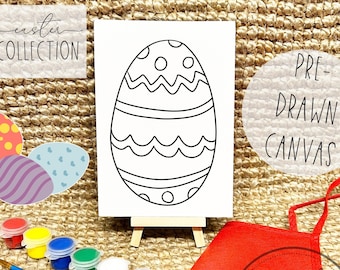 May include: A pre-drawn canvas of an Easter egg with a decorative design, displayed on a small wooden easel. The image includes paint pots in various colors, a paintbrush, a palette, and a red apron. Text reads "Easter Collection" and "Pre-Drawn Canvas".