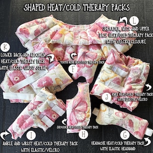 May include: A selection of heat/cold therapy packs in a pink and white floral and butterfly design. The packs are for various body parts, including the shoulder, back, abdomen, toothache, knee, ankle, wrist, and head. They feature elastic straps and Velcro fastenings. Text reads "SHAPED HEAT/COLD THERAPY PACKS".