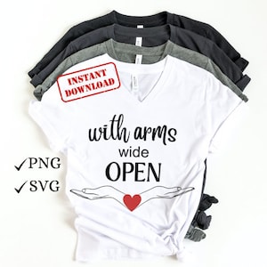 May include: A stack of v-neck t-shirts in white, gray, and black. The front shirt is white with the words "with arms wide OPEN" in black script, with a red heart between two open hands. The image also includes "PNG" and "SVG" text.