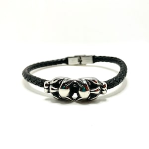 Double tête de panthère et bracelet en cuir tressé. Sac cadeau inclus