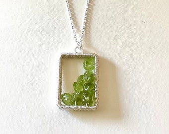 Genuine Peridot pendant, silver plated wire wrapped pendant with peridot chips set in resin. Choose chain length. Info card and gift bag inc