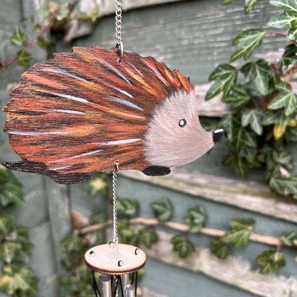 Hedgehog wind chime. Hand painted wood hedgehog with aluminum chimes. A donation from every sale is made to Rachel’s Hedgehog Hotel Ryston