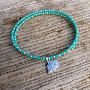Beaded anklet with hedgehog charm, wrap around one size fits all. A donation from every sale is donated to Rachel's hedgehog hotel Norfolk
