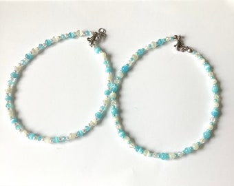 Set of two anklets.Pale blue and white cats eye beads.