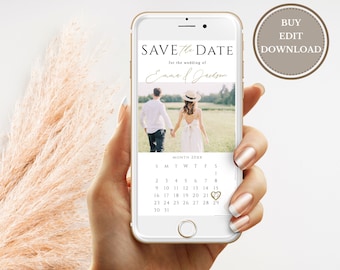 May include: A white and gold save the date phone screen mockup with a photo of a couple walking in a field. The text "Save the Date" is in black with a gold heart icon. The text "for the wedding of Emma & Jackson" is in black with a handwritten font. The calendar shows the month of 20XX with a gold heart icon on the 21st.