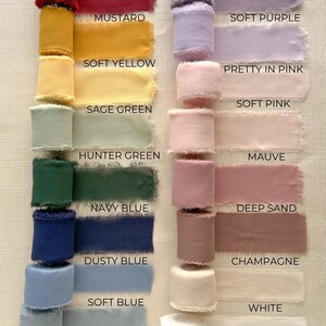 May include: A collection of 16 different colored silk ribbon rolls with frayed edges. The colors are burgundy, lavender, mustard, soft purple, soft yellow, pretty in pink, soft pink, sage green, hunter green, mauve, navy blue, deep sand, dusty blue, champagne, soft blue, and white.