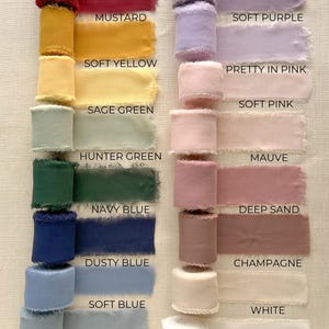 May include: A collection of 16 different colored silk ribbon rolls with frayed edges. The colors are burgundy, lavender, mustard, soft purple, soft yellow, pretty in pink, soft pink, sage green, hunter green, mauve, navy blue, deep sand, dusty blue, champagne, soft blue, and white.