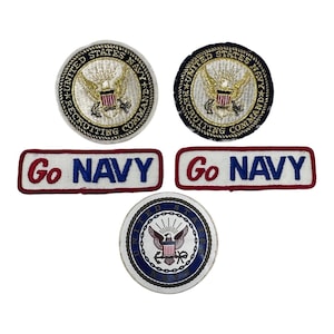 May include: Five embroidered patches including two circular United States Navy Recruiting Command emblems with gold eagles, two rectangular white patches with red borders and the blue text Go NAVY, and one circular United States Navy emblem.