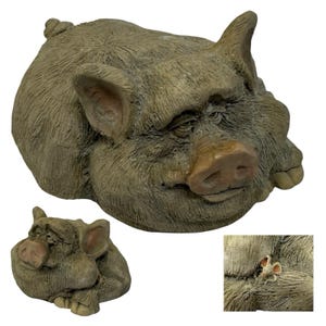 May include: A textured, brown, sculpted pig figurine in a resting position. The pig has a detailed, furrowed face, large ears, and a small curled tail. A separate close-up view shows a small, light-colored mouse perched on the pig's back.
