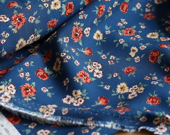 Viscose 125 g/m², petrol print, suitable for dresses or blouses, OEKO-TEX® Standard 100 certified.