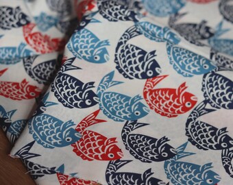 Cotton fabric with white fish print, suitable for clothing or accessories
