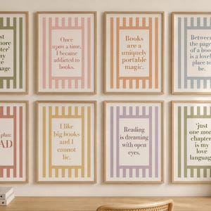May include: Eight rectangular wall art prints in light wooden frames, each featuring a vertical striped border in various pastel colours and centred black text with literary quotes about reading, arranged in two rows of four on a plain wall.