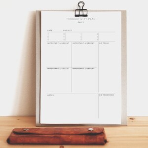 May include: A productivity planner with a daily schedule, project list, and sections for important and urgent tasks. The planner has sections for "Do Today" and "Do Tomorrow" and a notes section.