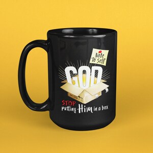 May include: Black coffee mug with a white "GOD" graphic inside a yellow box with the text "Stop putting Him in a box" and a yellow sticky note that says "Note to Self".