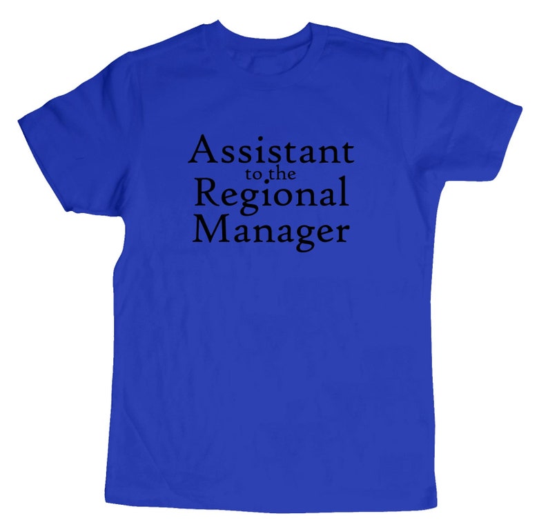 May include: A royal blue t-shirt with the text "Assistant to the Regional Manager" printed in black.