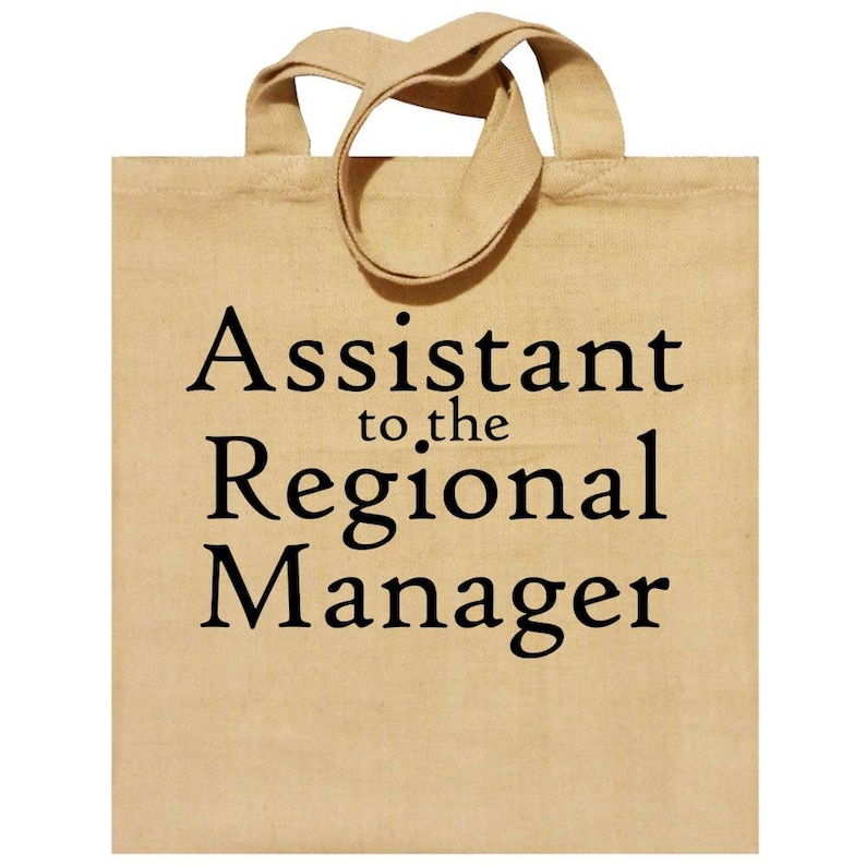 May include: A beige tote bag with black text that reads "Assistant to the Regional Manager".