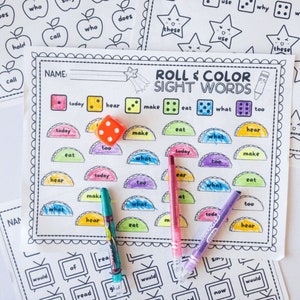 May include: A printable game for kids to practice sight words. The game includes a colorful game board with sight words, dice, and crayons. The game board has a title that says "Roll & Color Sight Words".