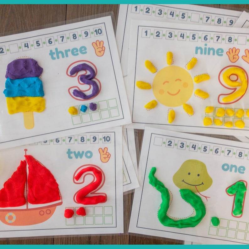 May include: A set of five printable cards for kids to practice counting with play dough. Each card features a number, a word, and a picture. The numbers are 1, 2, 3, 9, and 10. The pictures are a snake, a boat, an ice cream cone, a sun, and a hand.