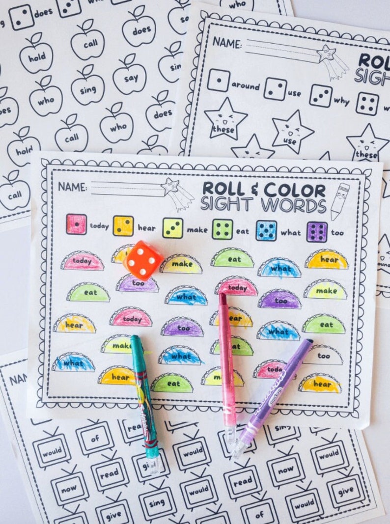 May include: A printable game for kids to practice sight words. The game includes a colorful game board with sight words, dice, and crayons. The game board has a title that says "Roll & Color Sight Words".