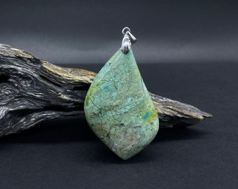 May include: A green and blue gemstone pendant with a silver bail. The pendant is shaped like a teardrop and has a mottled pattern.