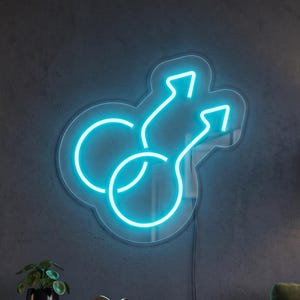 May include: A bright cyan neon sign featuring two interlocking circular symbols with upward-pointing arrows, mounted on a clear acrylic backing. The light emits a vibrant glow, creating a distinct outline of the connected shapes against the wall.