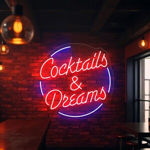Neon sign featuring the phrase "Cocktails & Dreams" – the perfect LED light for cocktail bars, lounges, pubs, and home bars. This vibrant sign adds a fun and trendy touch to any space, making it ideal for nightlife venues, cocktail parties, and those who love to indulge in creative cocktails. A must-have for any bar or cocktail enthusiast looking to set the mood!