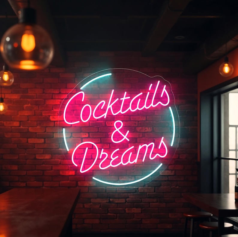 Neon sign featuring the phrase "Cocktails & Dreams" – the perfect LED light for cocktail bars, lounges, pubs, and home bars. This vibrant sign adds a fun and trendy touch to any space, making it ideal for nightlife venues, cocktail parties, and those who love to indulge in creative cocktails. A must-have for any bar or cocktail enthusiast looking to set the mood!