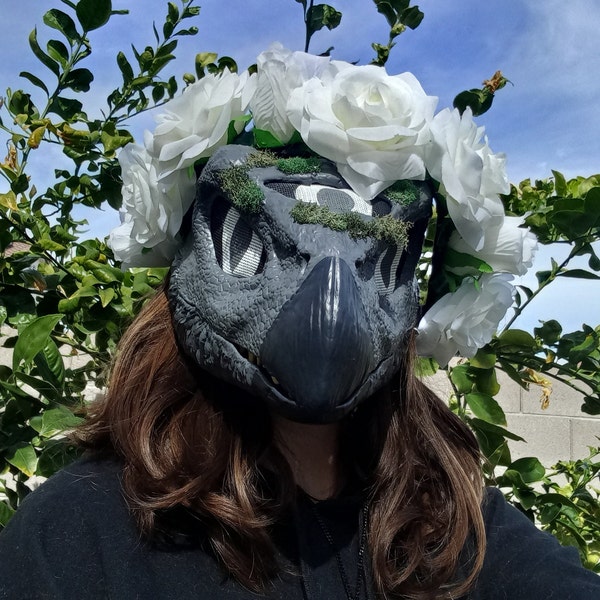 Gray cobblestone lookin bird dino mask with flower crown