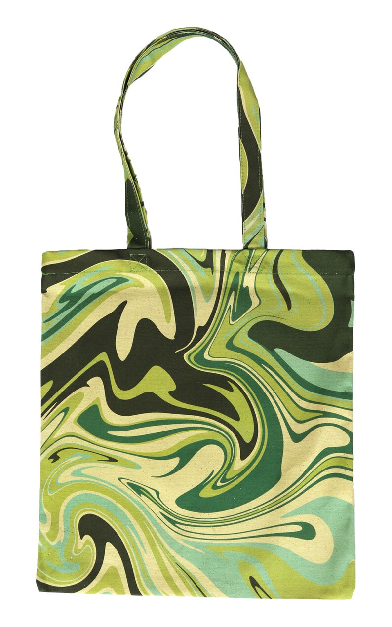 May include: A green and black tote bag with a swirling, marbled pattern. The bag has a rectangular shape with a matching handle. The design features shades of green, black, and cream, creating a psychedelic effect. The bag is made of fabric.