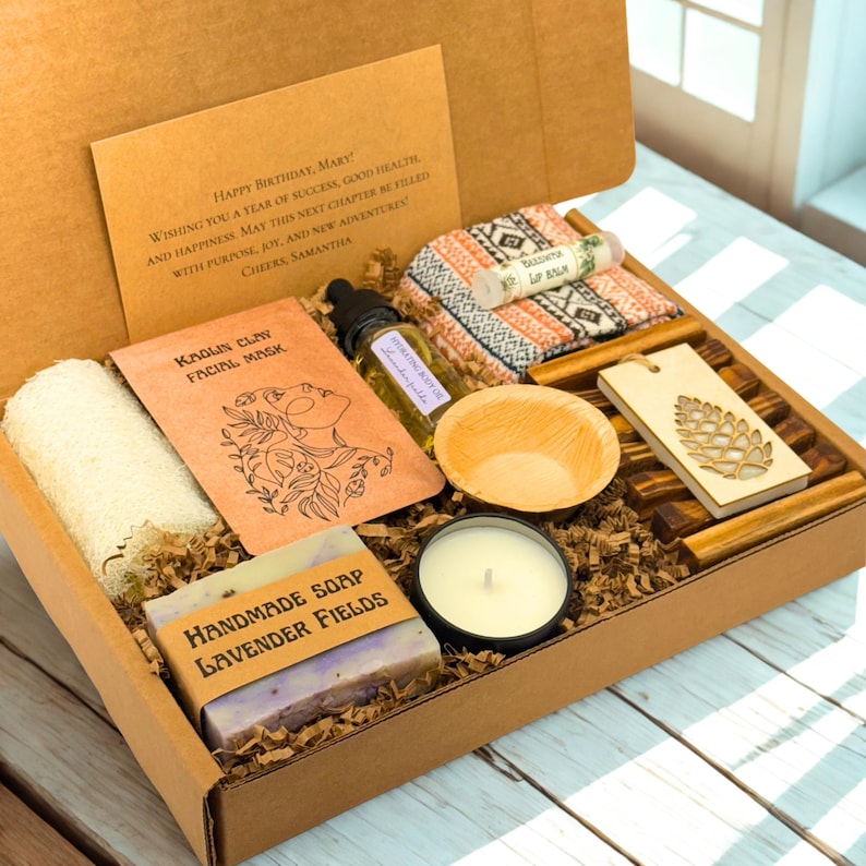 a wooden box containing a candle, soap, and other items