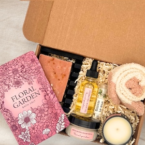 a box of soap, a candle, a book, and a candle