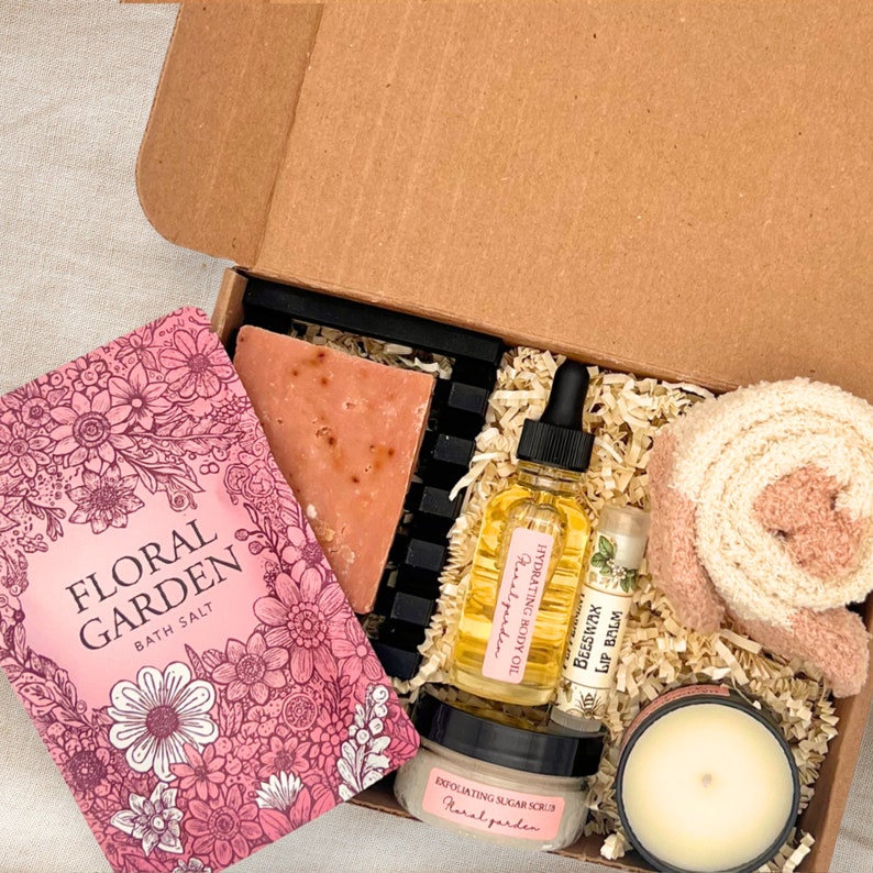 a box of soap, a candle, a book, and a candle