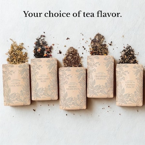 May include: Five packets of loose leaf tea, each with a different flavour: Citrus Cool Mint, Earl Grey Rose, Herbal Highlands, Cranberry Orange, and Ginger Peach. The text "Your choice of tea flavor" is at the top.