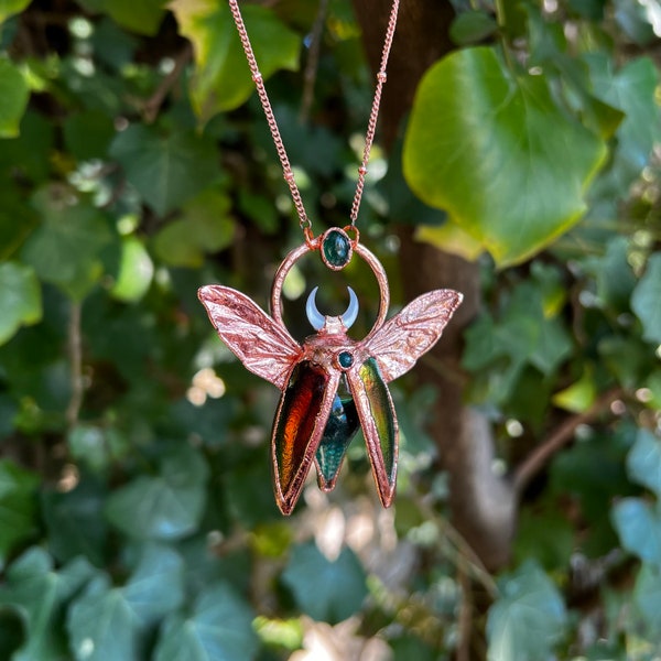 Chimera vial necklace with glittery green water, Copper eformed real beetle wings and elytras with two green onix and a seashell