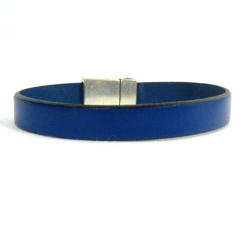 May include: A blue leather bracelet with a silver magnetic clasp.