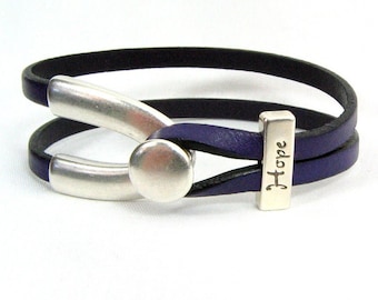 Pulsera "Esperanza" para la fibrosis quística - Pulsera de cuero morado de 5 mm con forma de hueso de la suerte, cierre deslizante de plata antigua con forma de hueso de la suerte y cierre de palanca (5FA-317)
