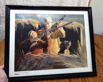 Litografía "Compartiendo el puesto de caza" de Leon Parson, 1977. Cazador profesional. Enmarcada y con paspartú.