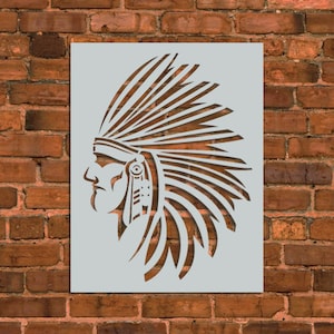 May include: A stencil of a Native American chief wearing a headdress with feathers. The stencil is on a white background.