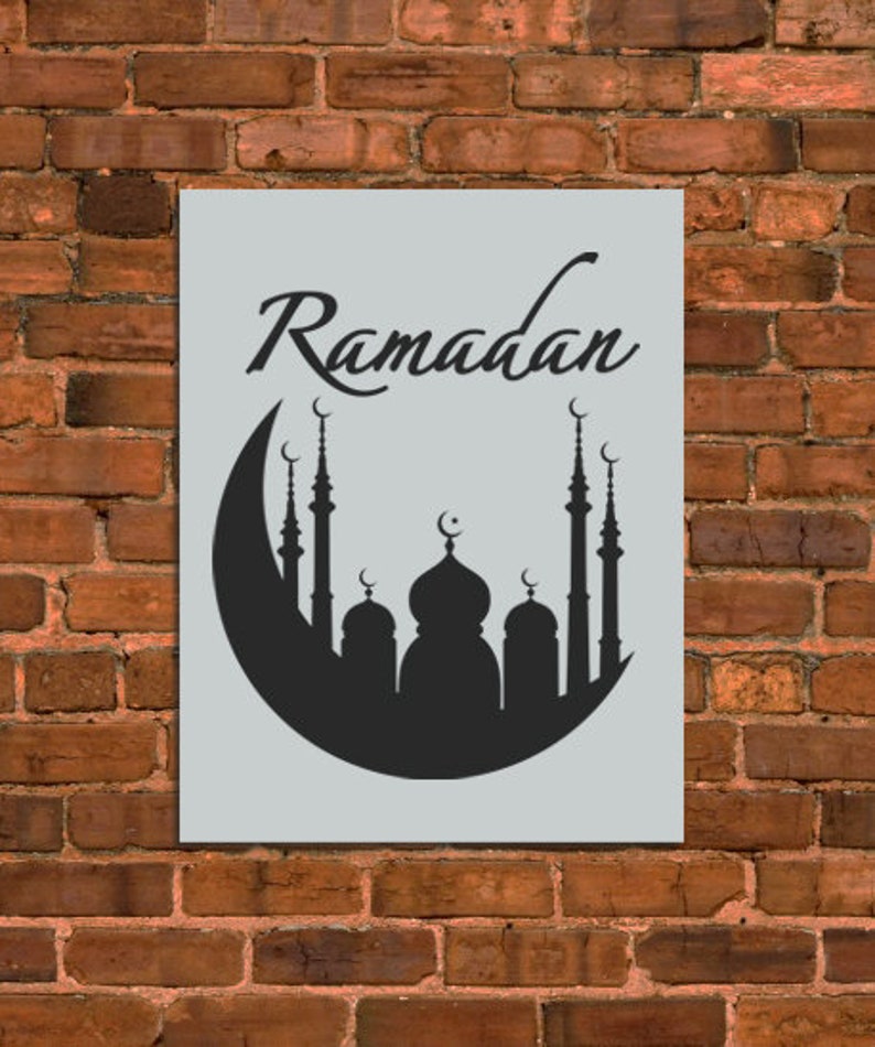 May include: A black and white silhouette of a mosque with minarets and a crescent moon on top. The text "Ramadan" is written in a decorative font above the mosque.