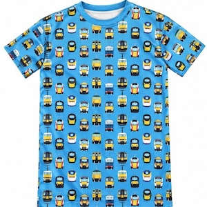 May include: A short-sleeved t-shirt in a bright blue colour featuring an all-over repeating pattern of various passenger trains. The graphic print displays multiple train designs in yellow, white, black, and red colours arranged in a grid layout.