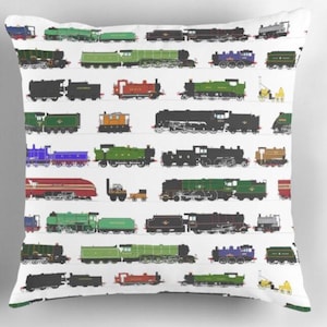 May include: White square cushion featuring a repeating pattern of colourful train illustrations. The trains are in various colours, including green, black, red, and blue. The cushion is a decorative item.