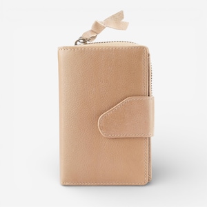 May include: A light tan leather wallet with a zip closure and a flap secured by a press stud. The wallet has a small bow-shaped leather pull tab attached to the zip. The wallet is a neutral colour and has a simple, classic design.