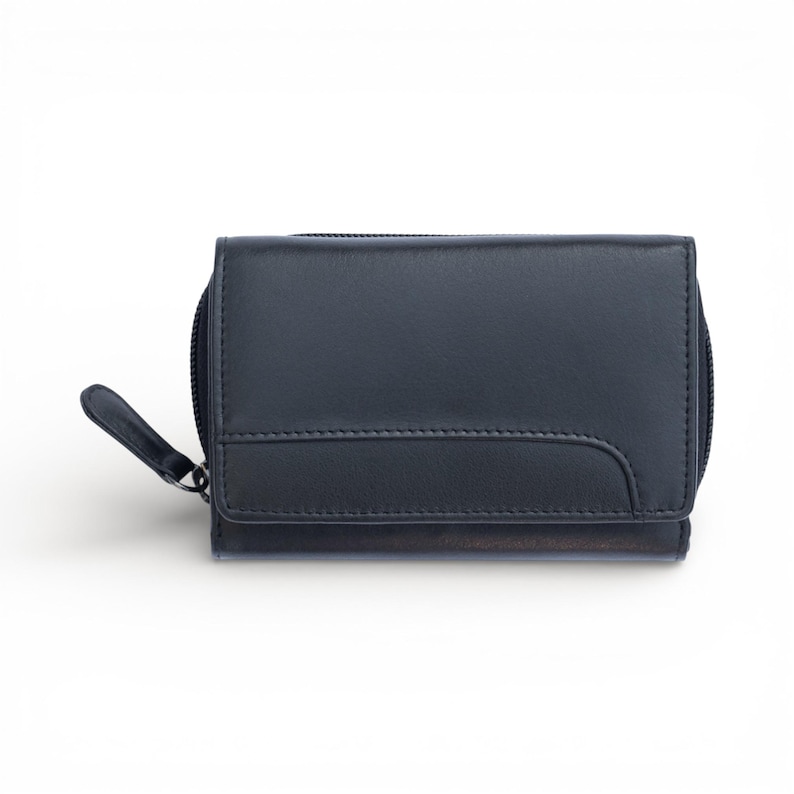 May include: A dark navy blue leather wallet featuring a rectangular flap with a curved stitched seam detail. The wallet includes a side zip closure with a matching leather pull tab, providing a secure and compact design for everyday storage.