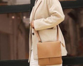 Bolso de piel auténtica para mujer, bolso de ciudad con correa ajustable y bolsillos con cremallera.