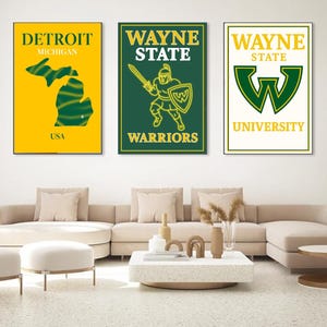 May include: Three framed wall art pieces. The first features a yellow background with a green outline of Michigan and the text "DETROIT MICHIGAN USA". The second has a green background with a warrior graphic and the text "WAYNE STATE WARRIORS". The third has a white background with the text "WAYNE STATE UNIVERSITY".