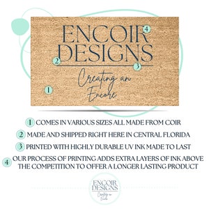 May include: A brown coir doormat with the text "ENCOIR DESIGNS Creating an Encore" in dark blue lettering. The numbers 1, 2, 3, and 4 are circled in blue and placed around the text. The doormat is a product of ENCOIR DESIGNS.