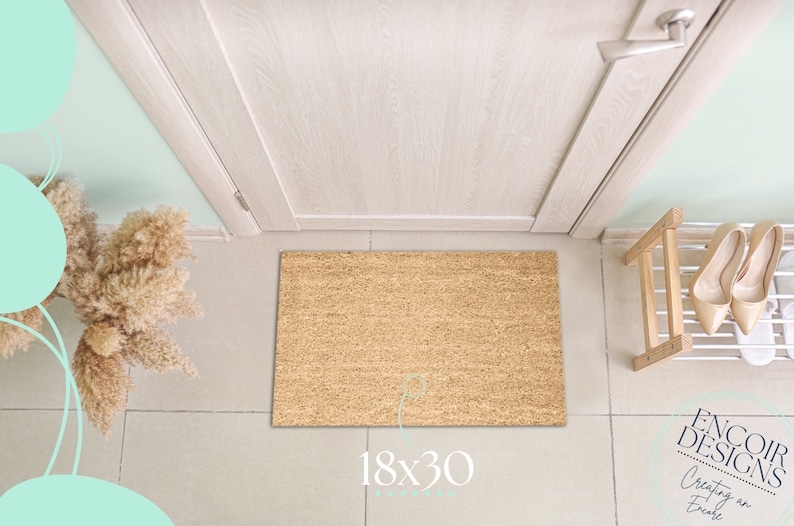 May include: A brown coir doormat with the text "18x30" printed on it. The doormat is placed in front of a white door with a silver door handle.