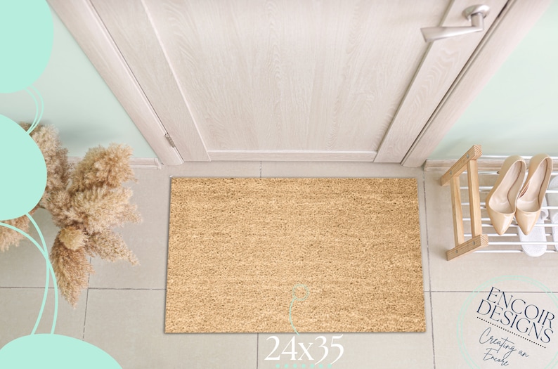 May include: A brown coir doormat with the text "24x35" printed on the bottom. The doormat is in front of a white door with a silver door handle.